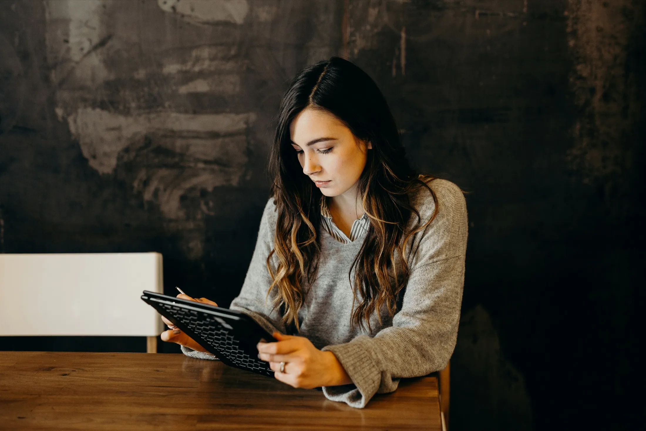 A program manager reviewing ideas on a tablet